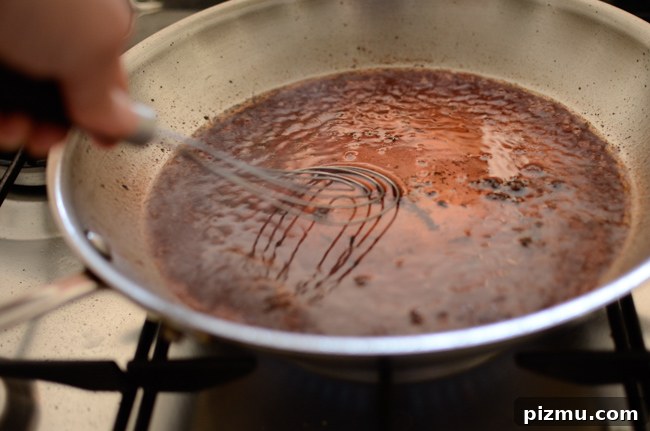 Classic Japanese Hambagu (Hamburger Steak) Recipe 8 A whisk is used to make red wine reduction sauce for hambagu.