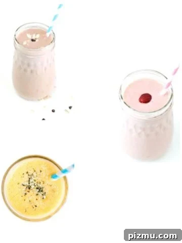 Three different smoothies in glass jars.