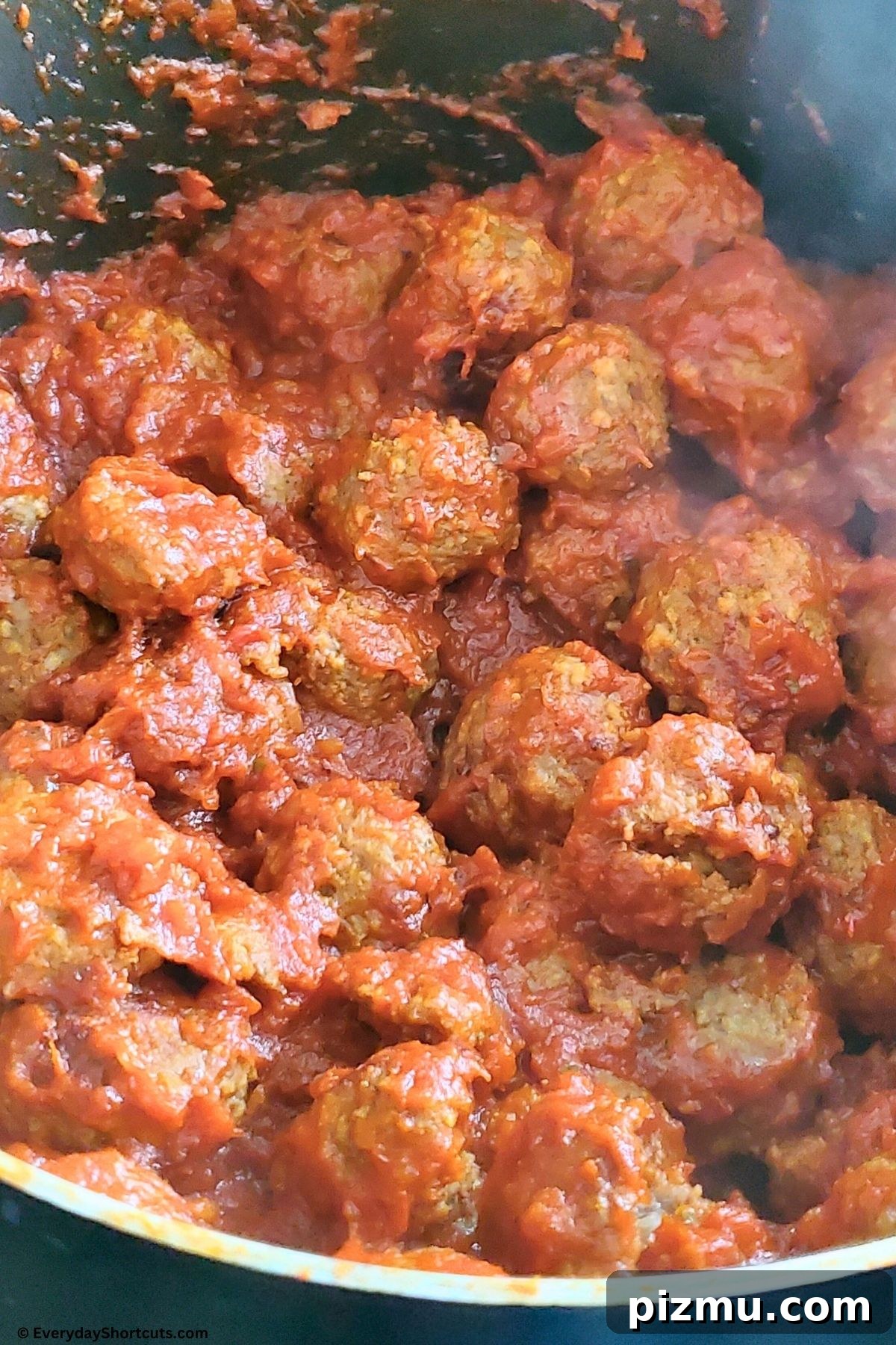 meatballs and sauce in a pan