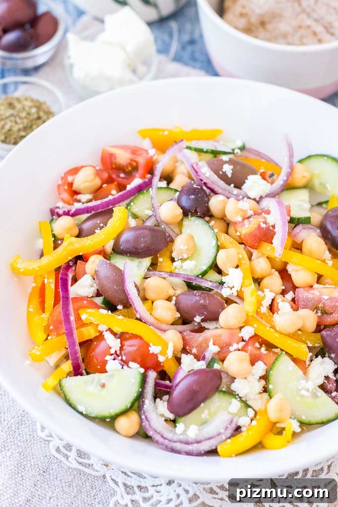 Healthy Greek Chickpea Salad with tomatoes, cucumber, olives, and feta