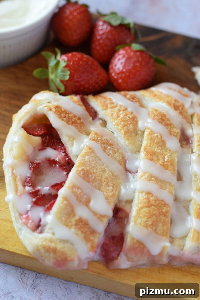 Homemade Strawberry Puff Pastry Danish Recipe 13 Close up of a strawberry cream cheese danish.