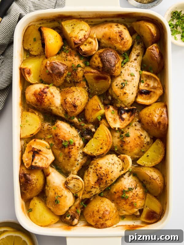 Juicy Grilled Lemon Chicken with Garlic and Herbs 3 Roasted chicken drumsticks with potatoes and garlic, garnished with herbs.