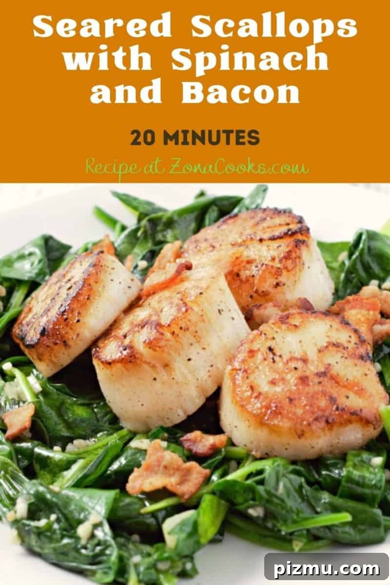 Seared Scallops with Garlic Butter Spinach 10 Seared Scallops with Spinach and Bacon on a plate.