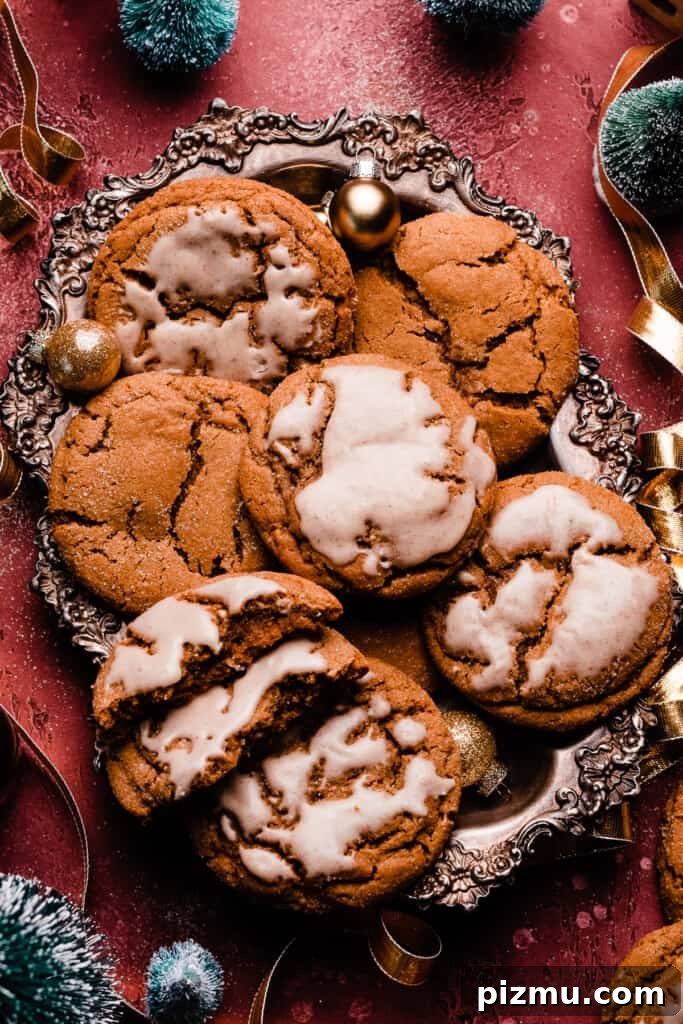 A vintage tray of crinkly molasses cookies, some with icing on top.