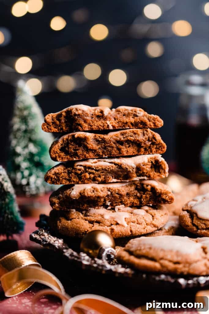 A wide angle photo of the stacked cookies with a backdrop of twinkling lights.