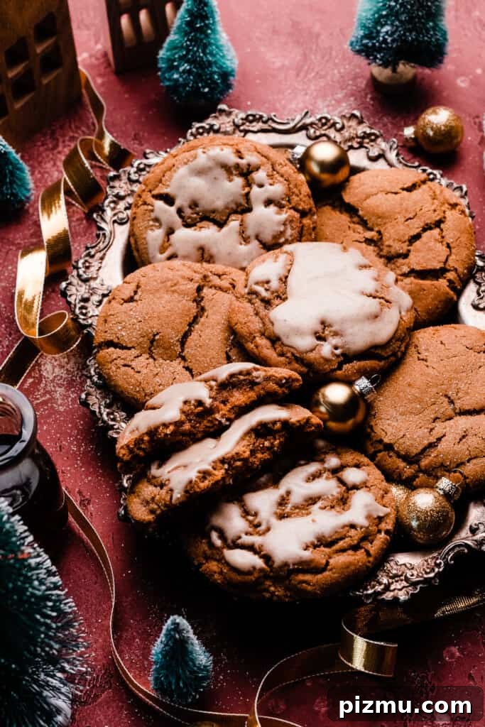 A tray of molasses cookies, some with maple icing.