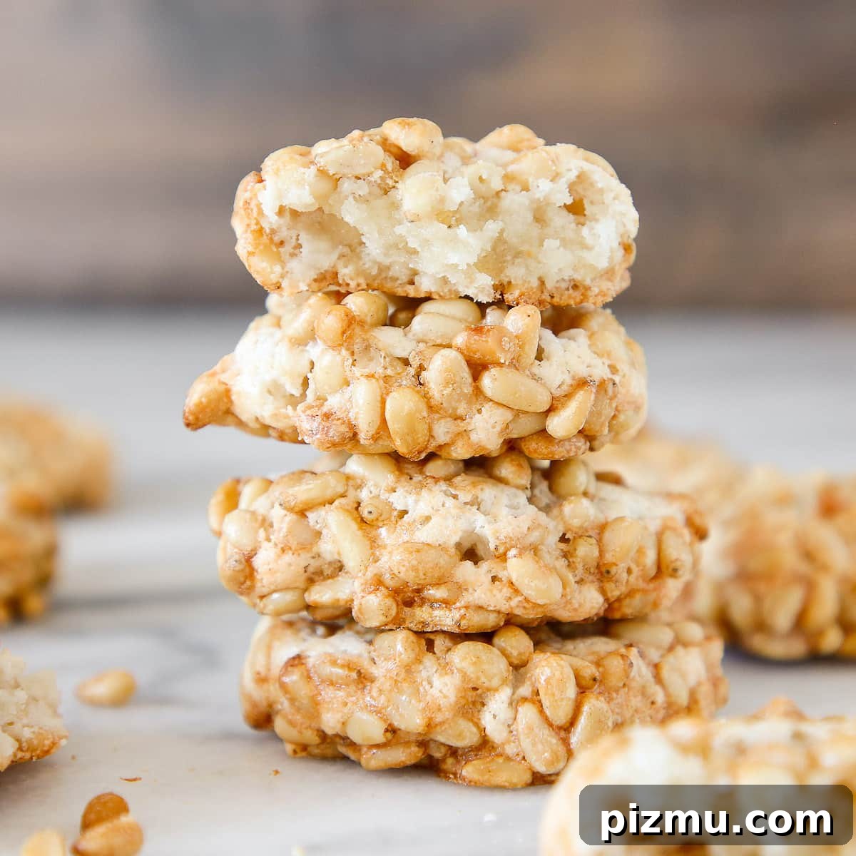 20 Classic Christmas Cookie Recipes to Bake This Season 9 Pignoli Cookies stacked interior detail.