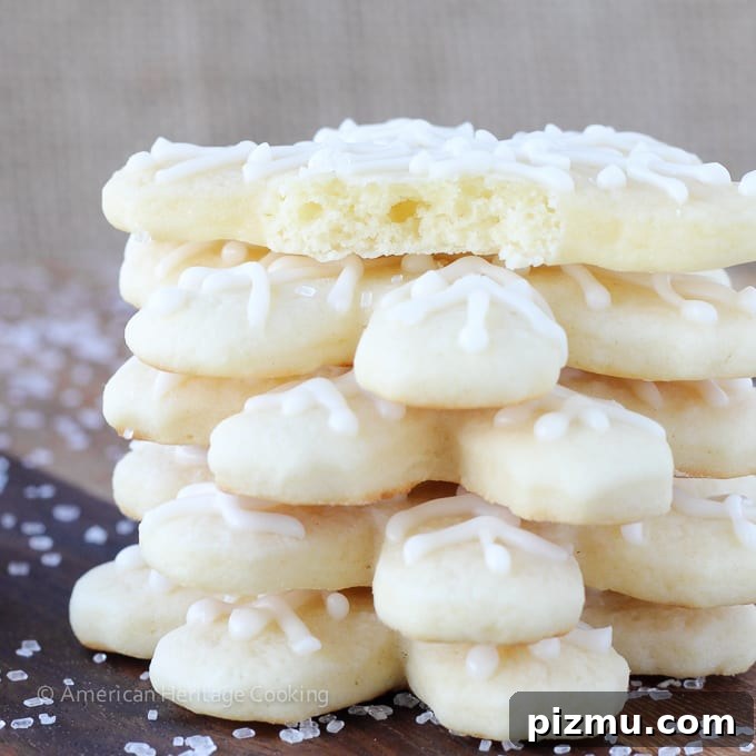 20 Classic Christmas Cookie Recipes to Bake This Season 13 soft sugar cookies shaped like snowflakes stacked.