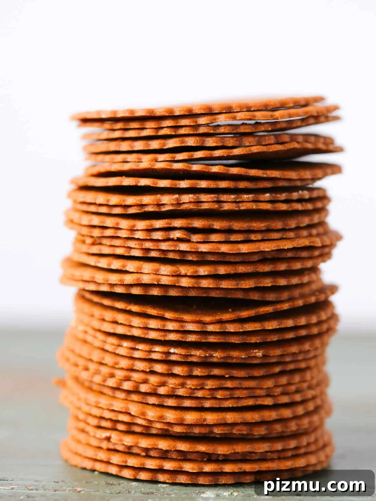20 Classic Christmas Cookie Recipes to Bake This Season 15 Moravian Christmas Cookies stacked tall white background.