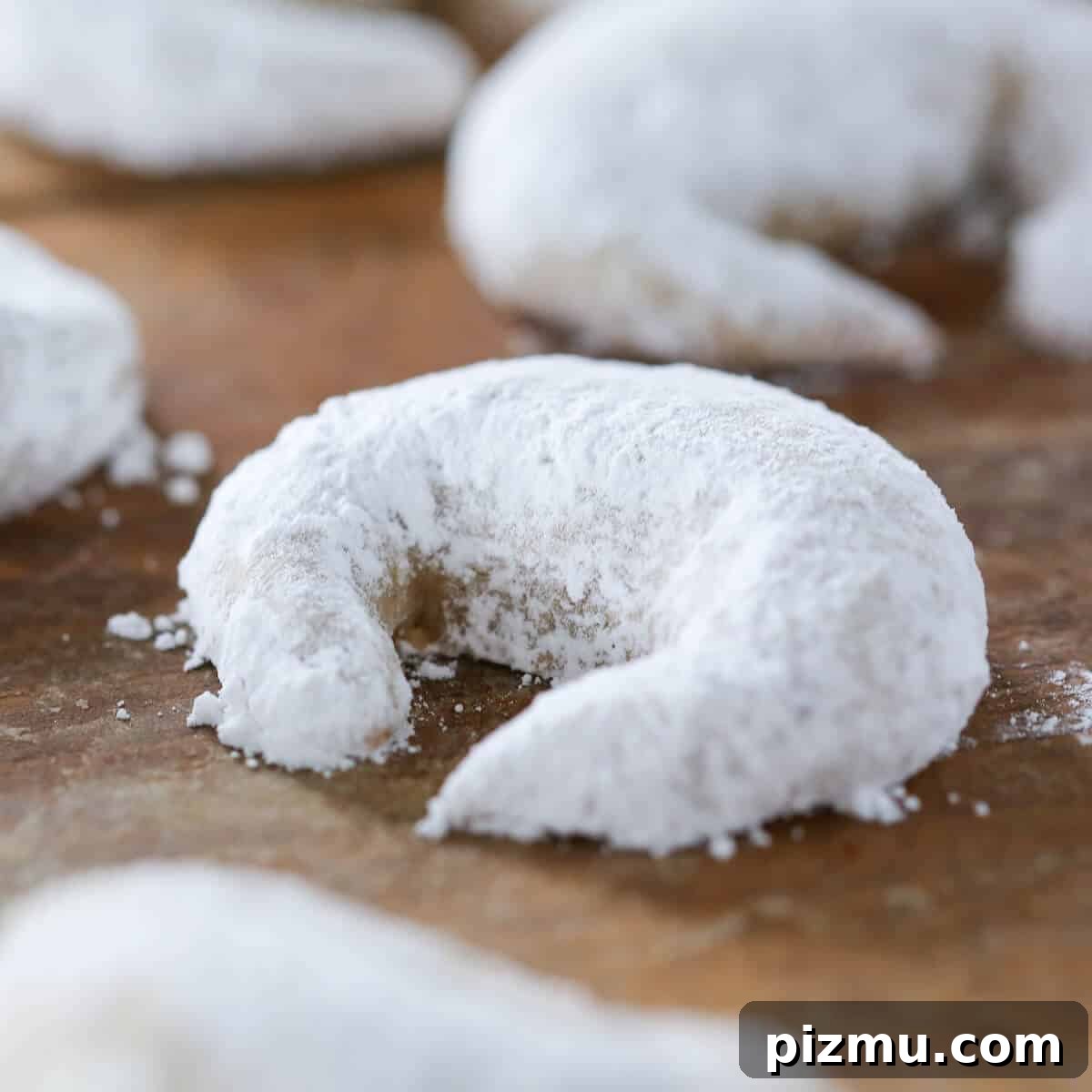 20 Classic Christmas Cookie Recipes to Bake This Season 18 Cardamom Crescent Cookies powdered sugar.