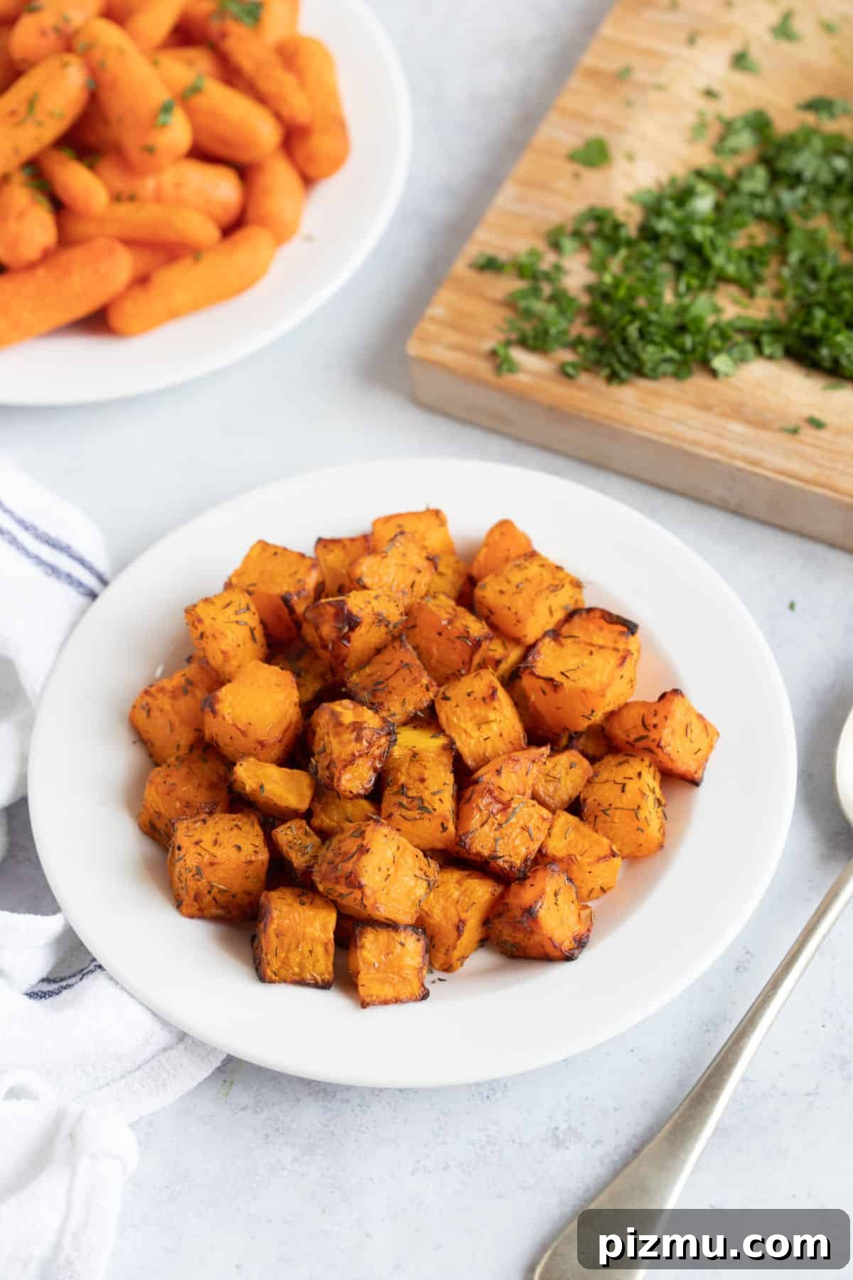 Crispy Air Fryer Butternut Squash with Garlic and Herbs 5 A plate of air fryer butternut squash.