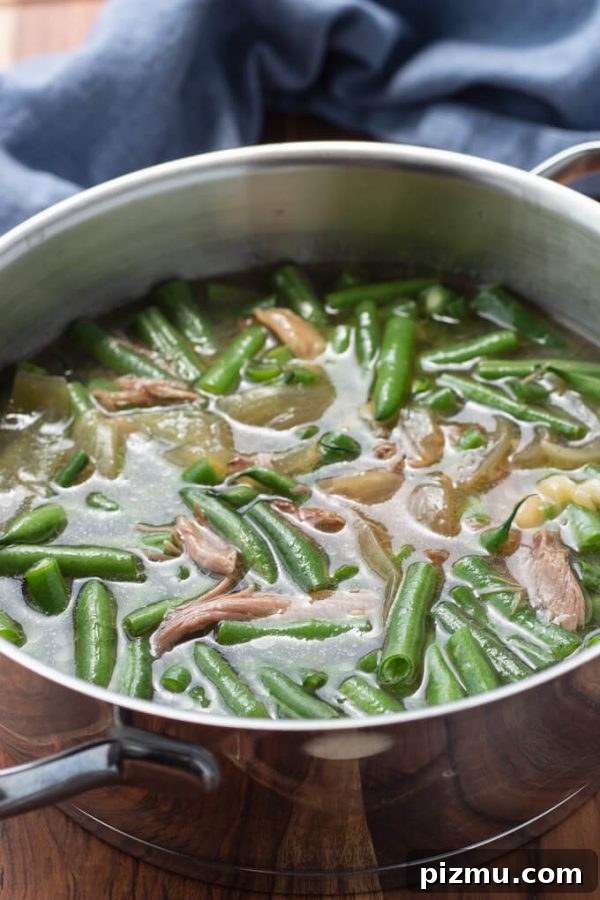 Southern green beans with pork and pot liquor in a pot.