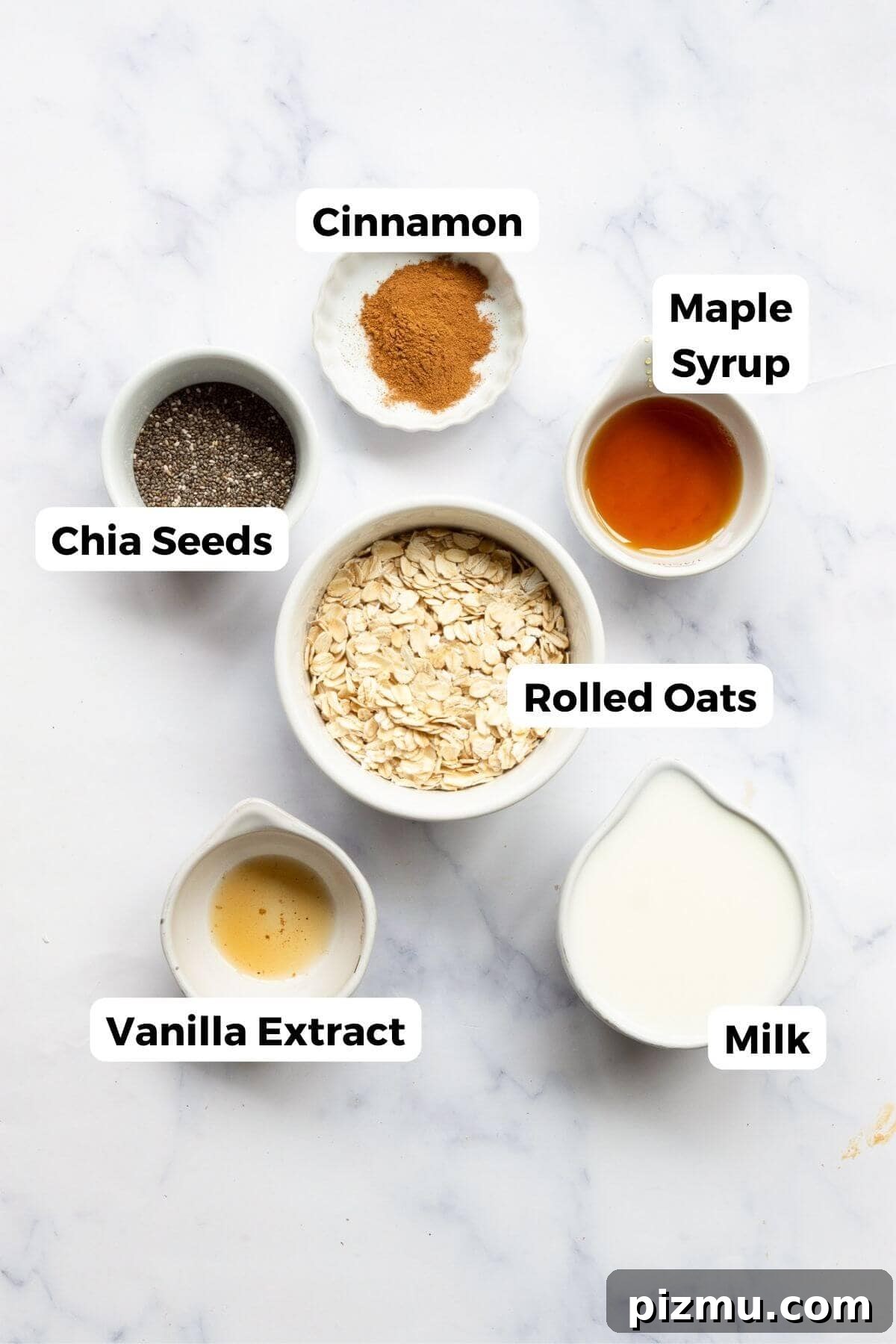 Creamy Cinnamon Overnight Oats for Make-Ahead Breakfast 3 Ingredients for cinnamon overnight oats including rolled oats, chia seeds, cinnamon, maple syrup, and milk.