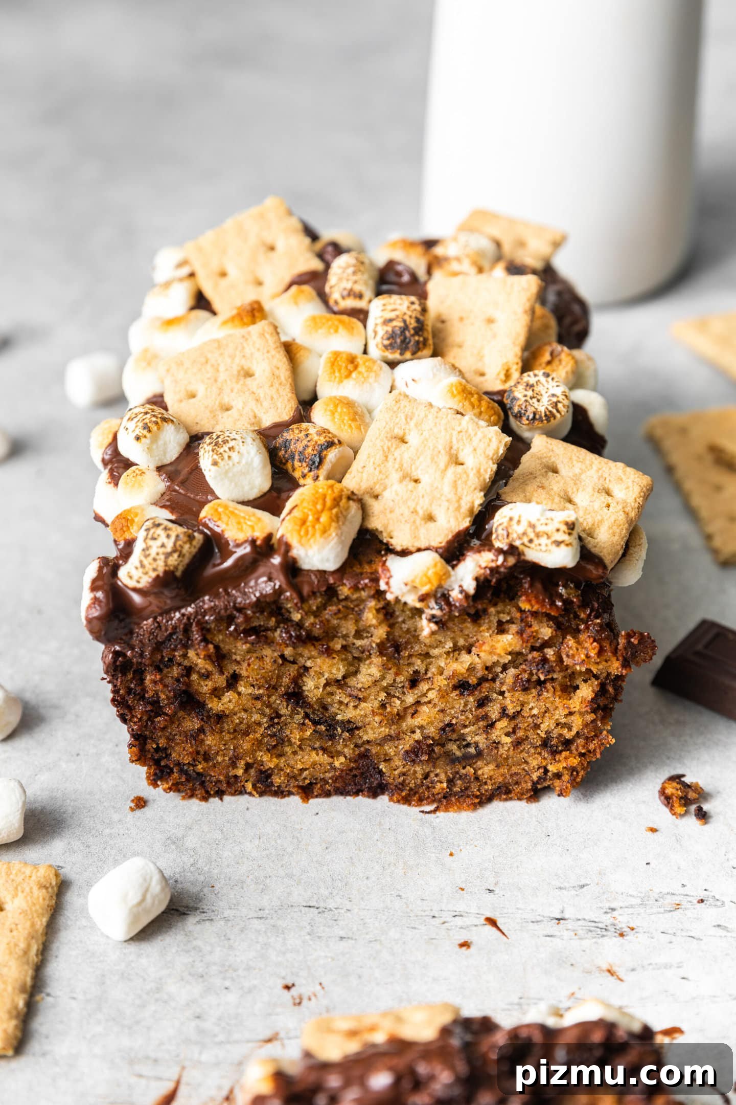 S'mores Banana Bread loaf with a slice missing