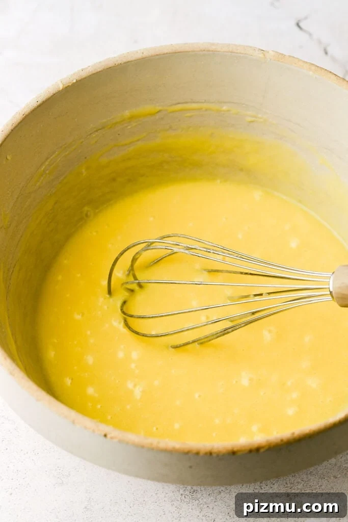 add the eggs, one at a time and whisk well between each one