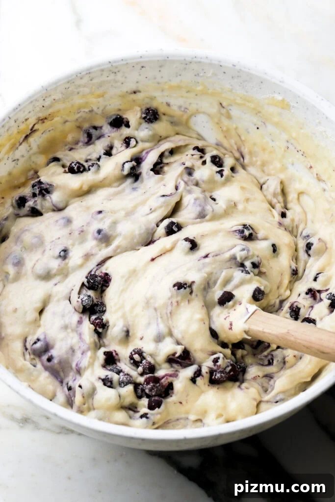 blueberries mixed into batter