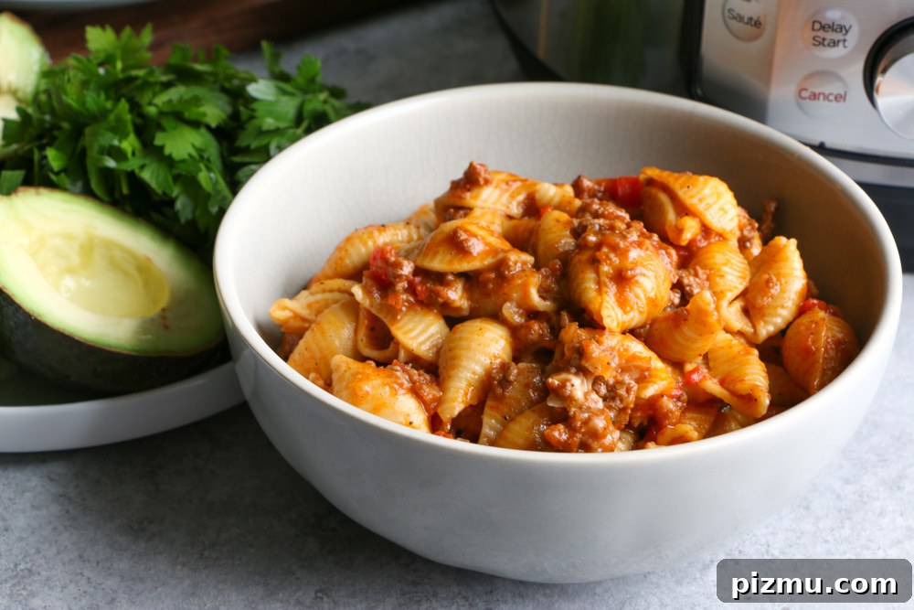 Instant Pot Cheesy Taco Pasta - creamy, flavorful, made in the Instant Pot without pre-cooking the pasta