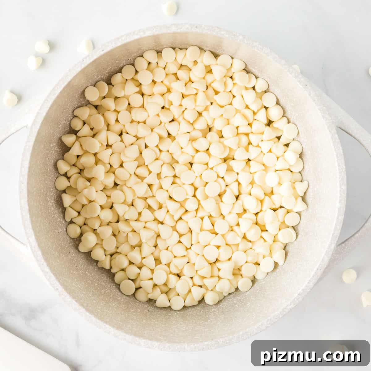 white chocolate chips in a sauce pan