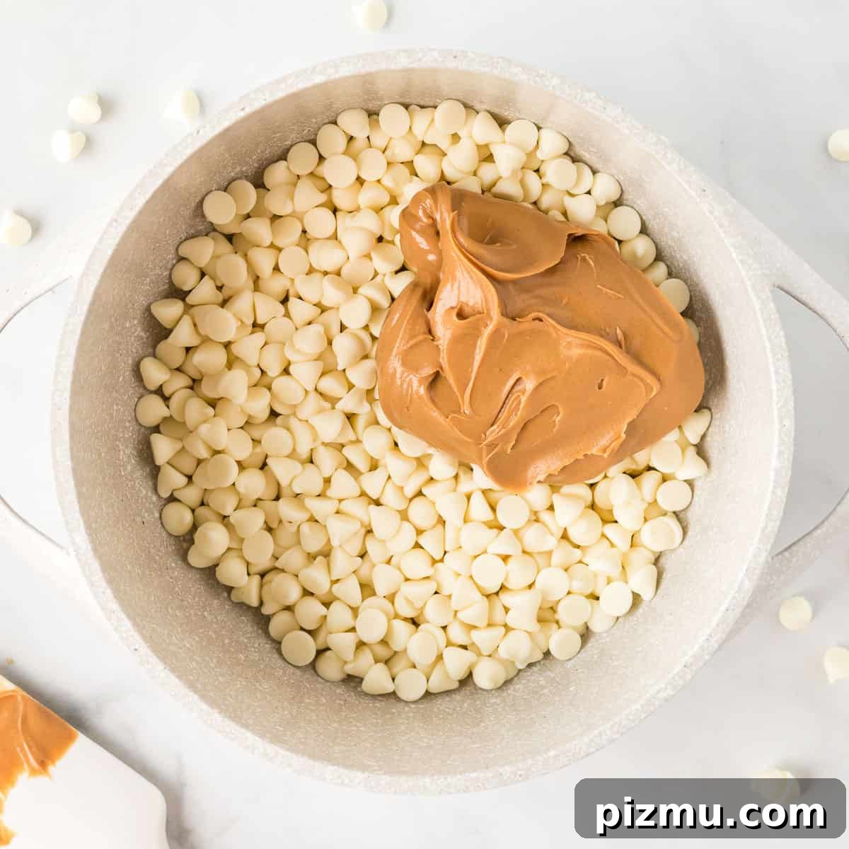 white chocolate chips with peanut butter in a sauce pan