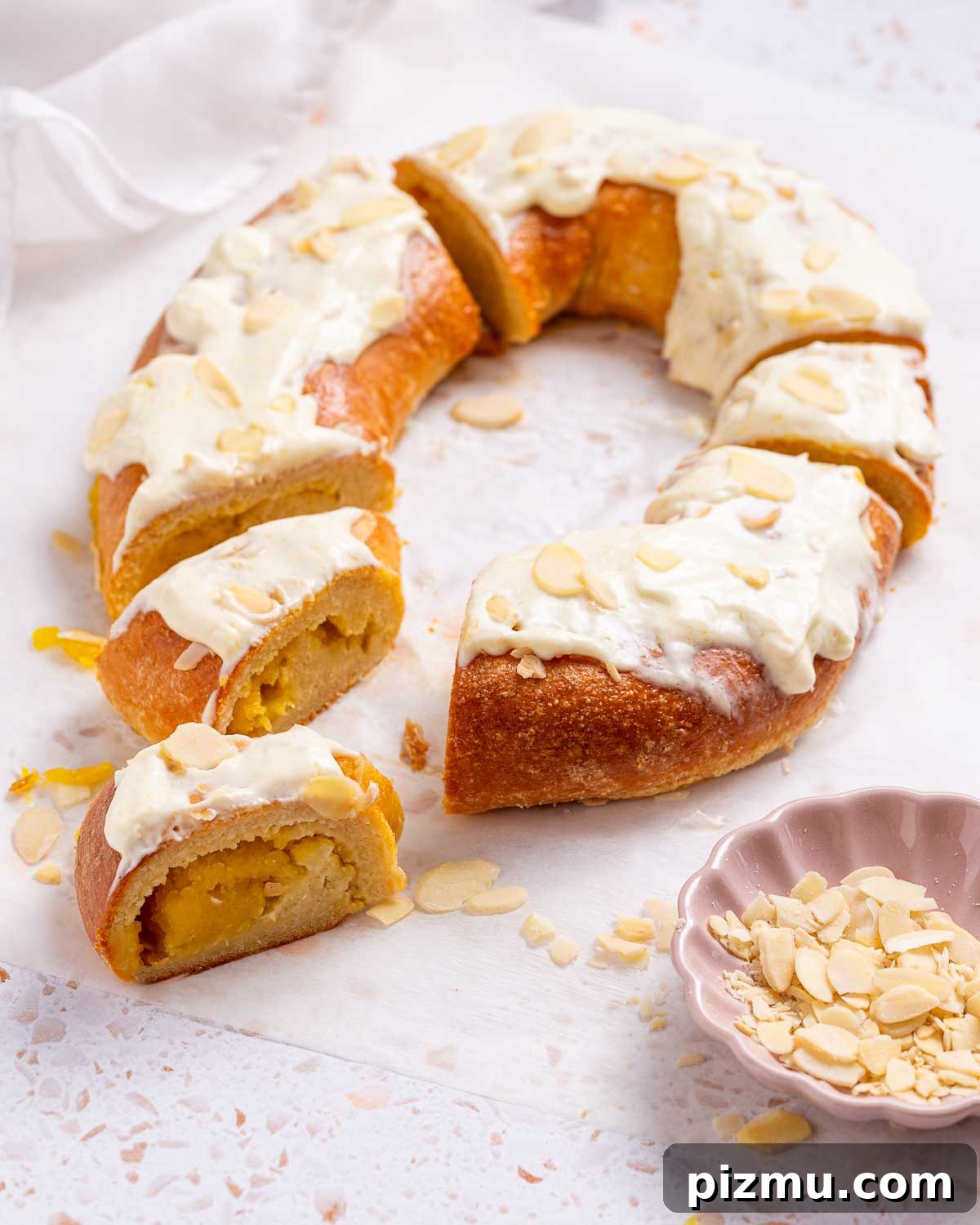 Keto Pumpkin Kringle Danish: Flaky Low-Carb Recipe 2 A keto pumpkin Kringle Danish is a pastry ring with a pumpkin cream filling, and cream cheese frosting with sliced almonds for garnish.