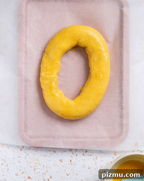 Keto Pumpkin Kringle Danish: Flaky Low-Carb Recipe 14 Brushing kringle with yolk.