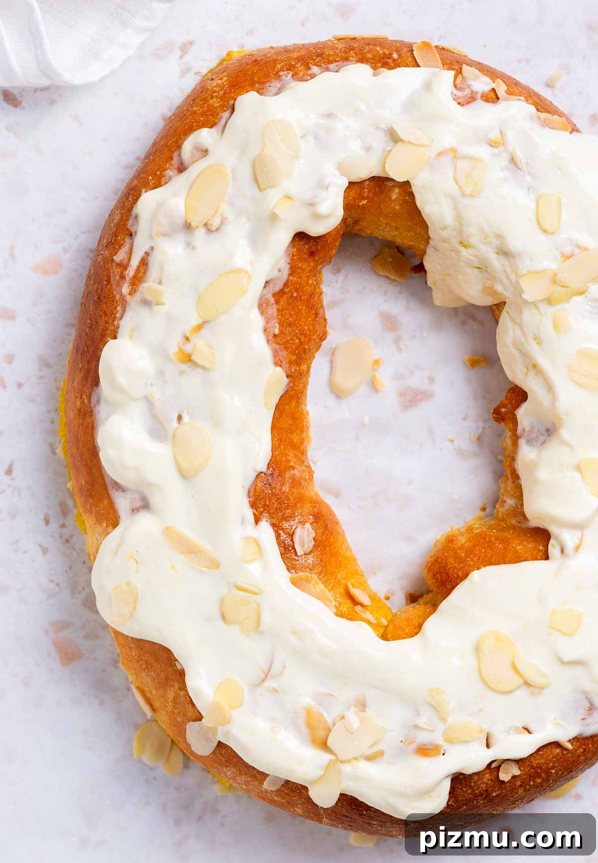 Keto Pumpkin Kringle Danish: Flaky Low-Carb Recipe 3 A keto pumpkin kringle danish is a pastry ring with a pumpkin cream filling, and cream cheese frosting with sliced almonds for garnish.
