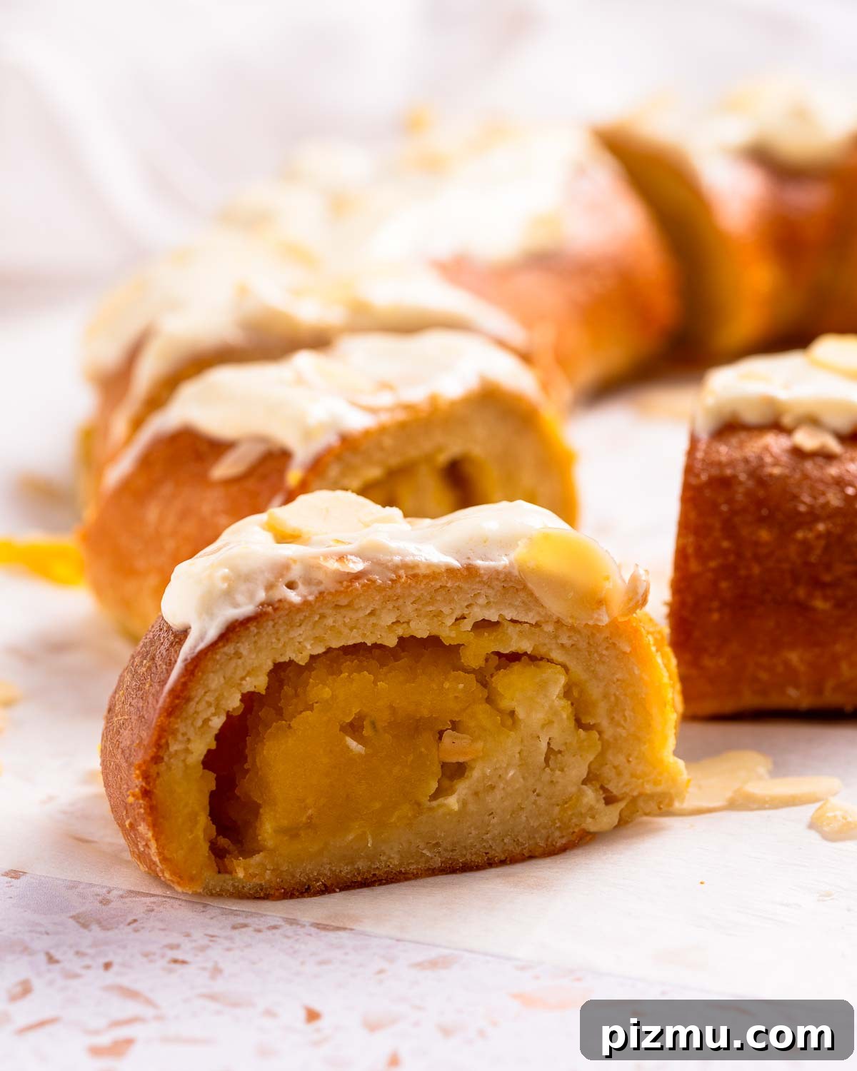 Keto Pumpkin Kringle Danish: Flaky Low-Carb Recipe 4 Keto Pumpkin Kringle Danish is a pastry ring with a pumpkin cream filling, and cream cheese frosting with sliced almonds for garnish.