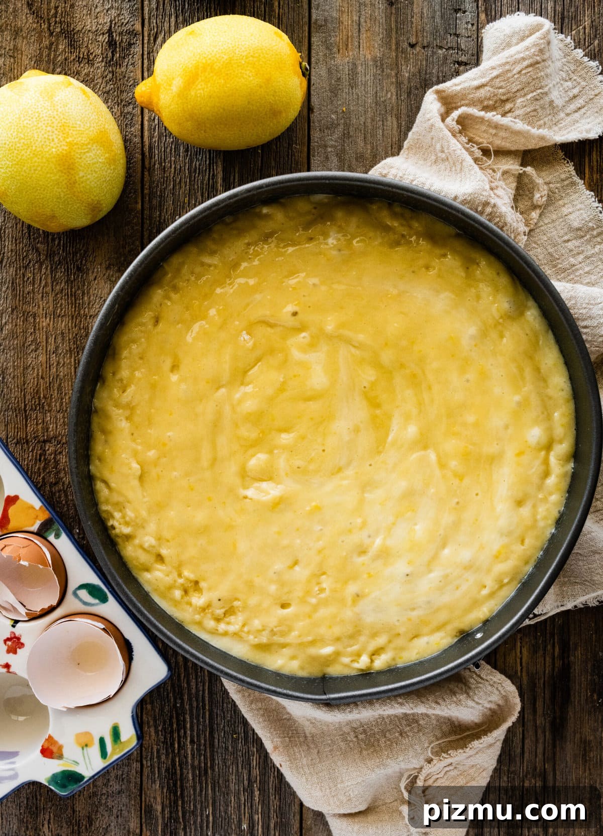 How to make olive oil cake (step-by-step) instructions- adding cake batter to the pan.