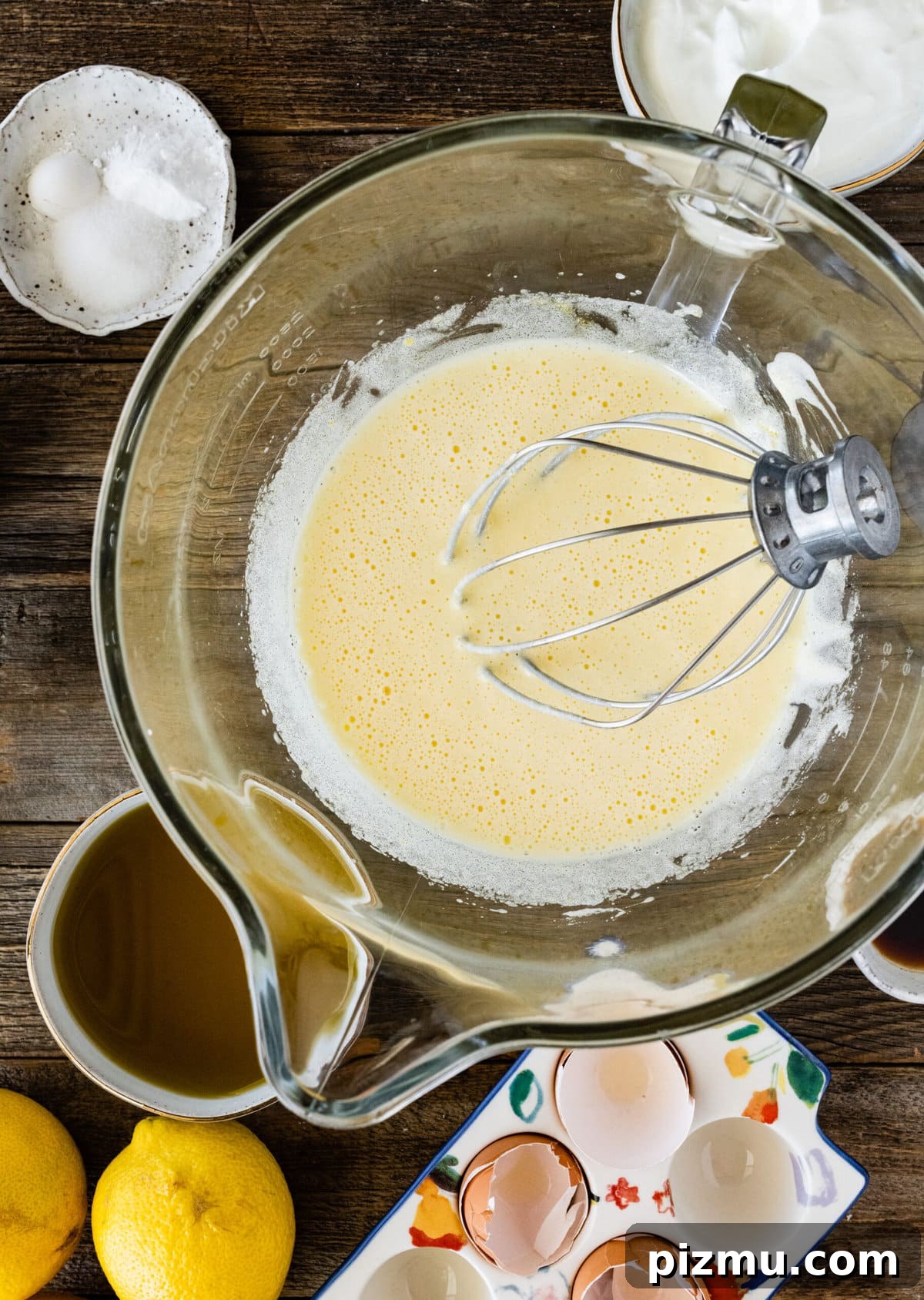 How to make olive oil cake (step-by-step) instructions- mixing eggs and sugar with whisk.