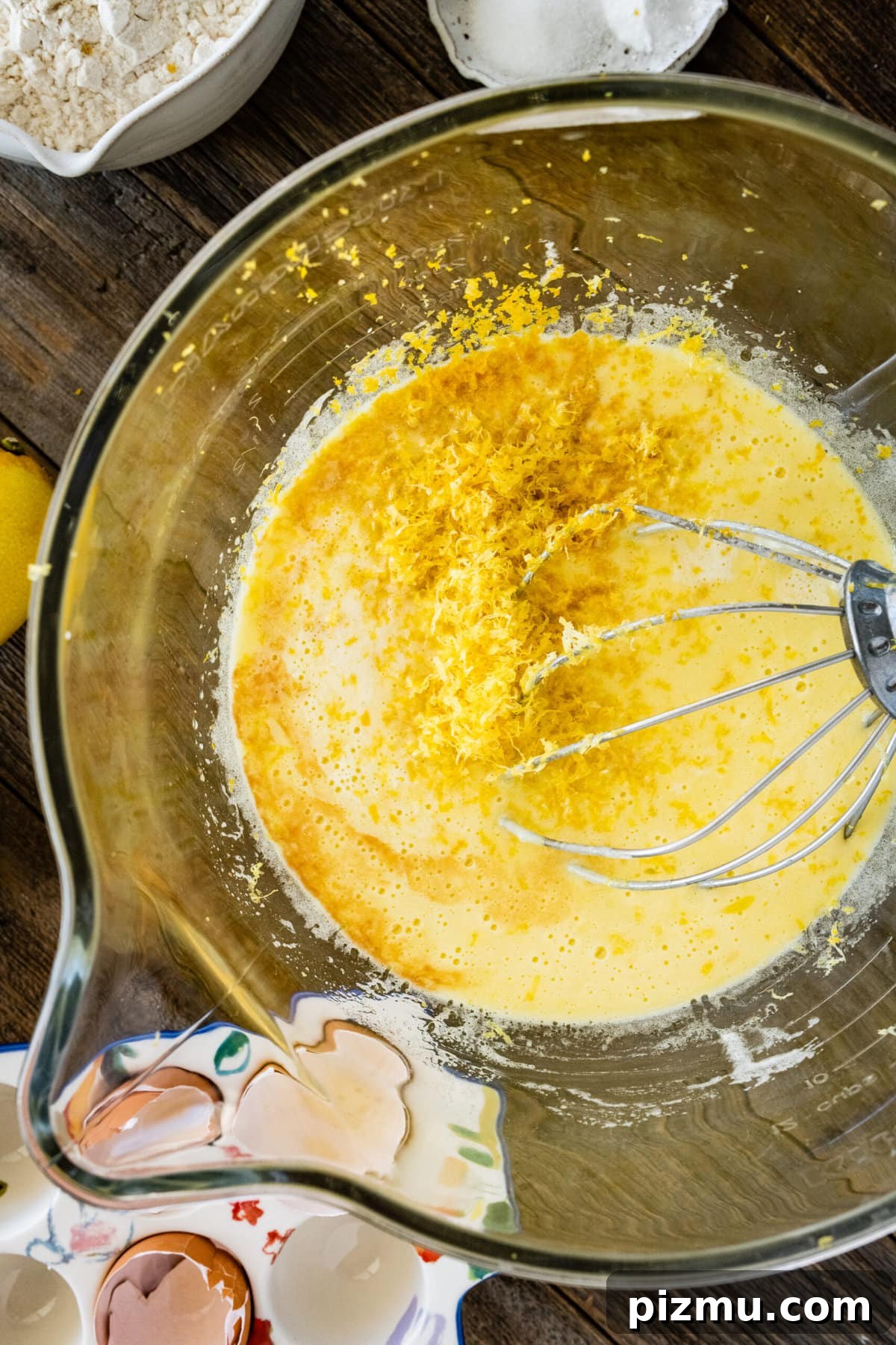 How to make olive oil cake (step-by-step) instructions- adding the lemon zest.