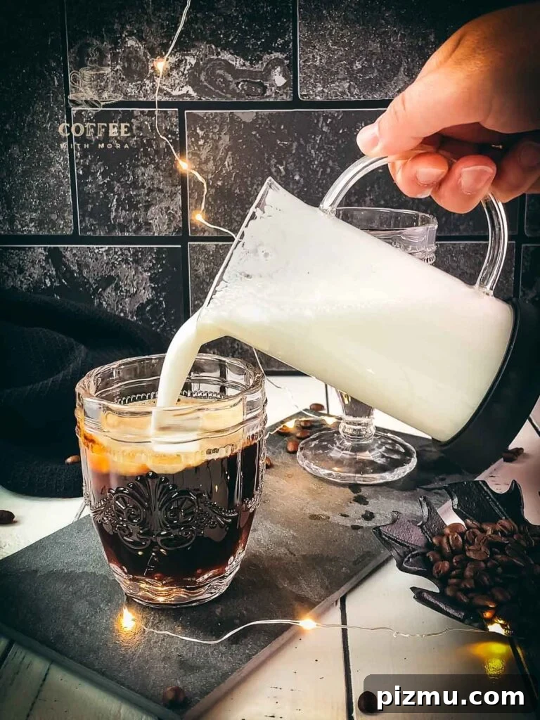 How to Make Café con Leche: Classic Spanish Coffee Recipe 4 Top the coffee with frothed milk.