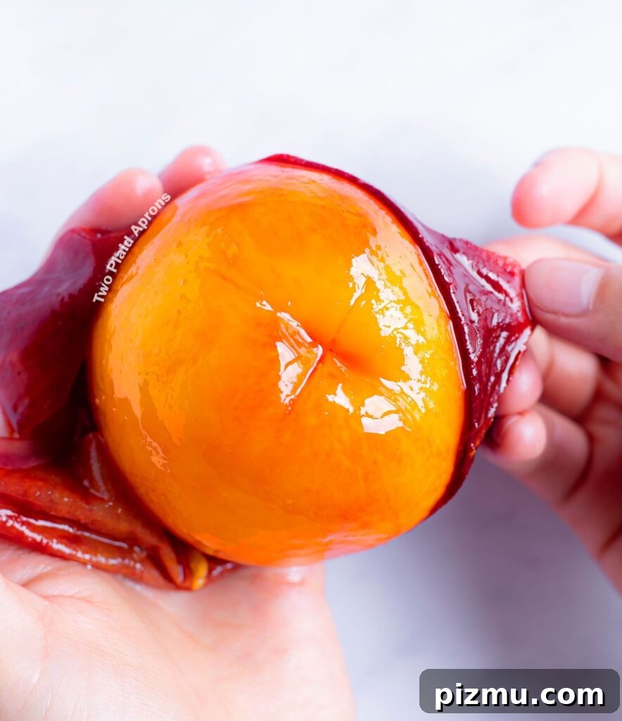 Classic Old-Fashioned Peach Cobbler Recipe 7 Easily peeling peach skin off of a peach.