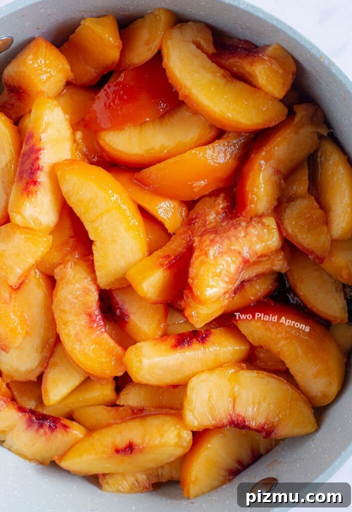 Classic Old-Fashioned Peach Cobbler Recipe 9 A pot of peach wedges ready for cobbler filling making.