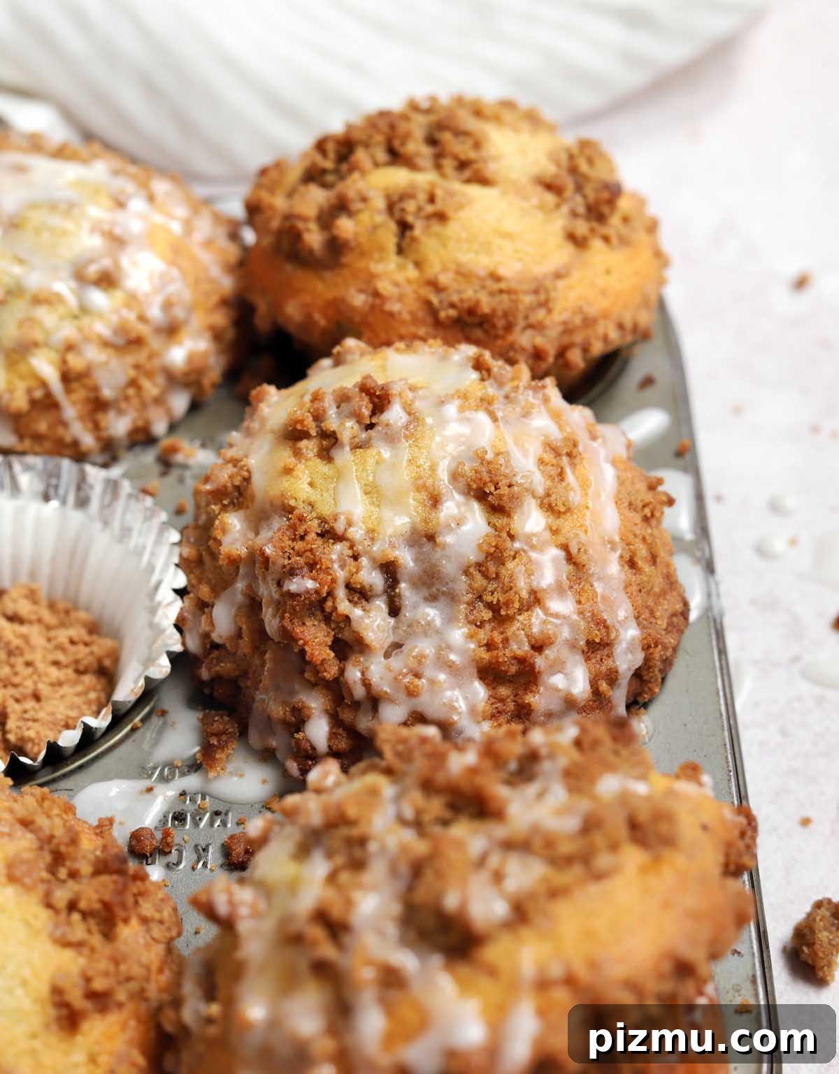 Sour Cream Coffee Cake Muffins Recipe with Cinnamon Streusel 7 close up on sour cream coffee cake muffin tops in muffin pan