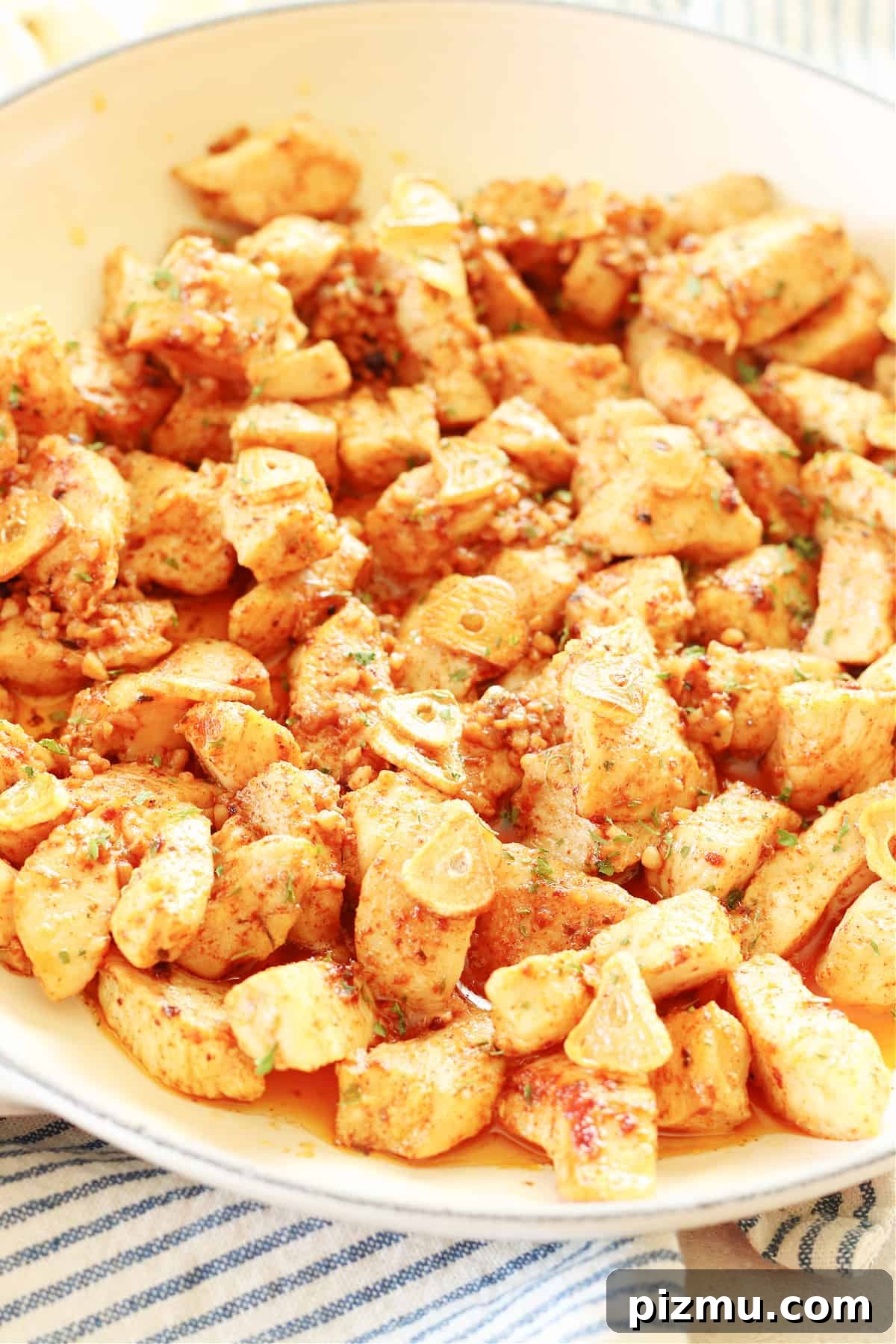 Garlic Butter Chicken. Chicken bites in a pan with garlic and butter sauce.