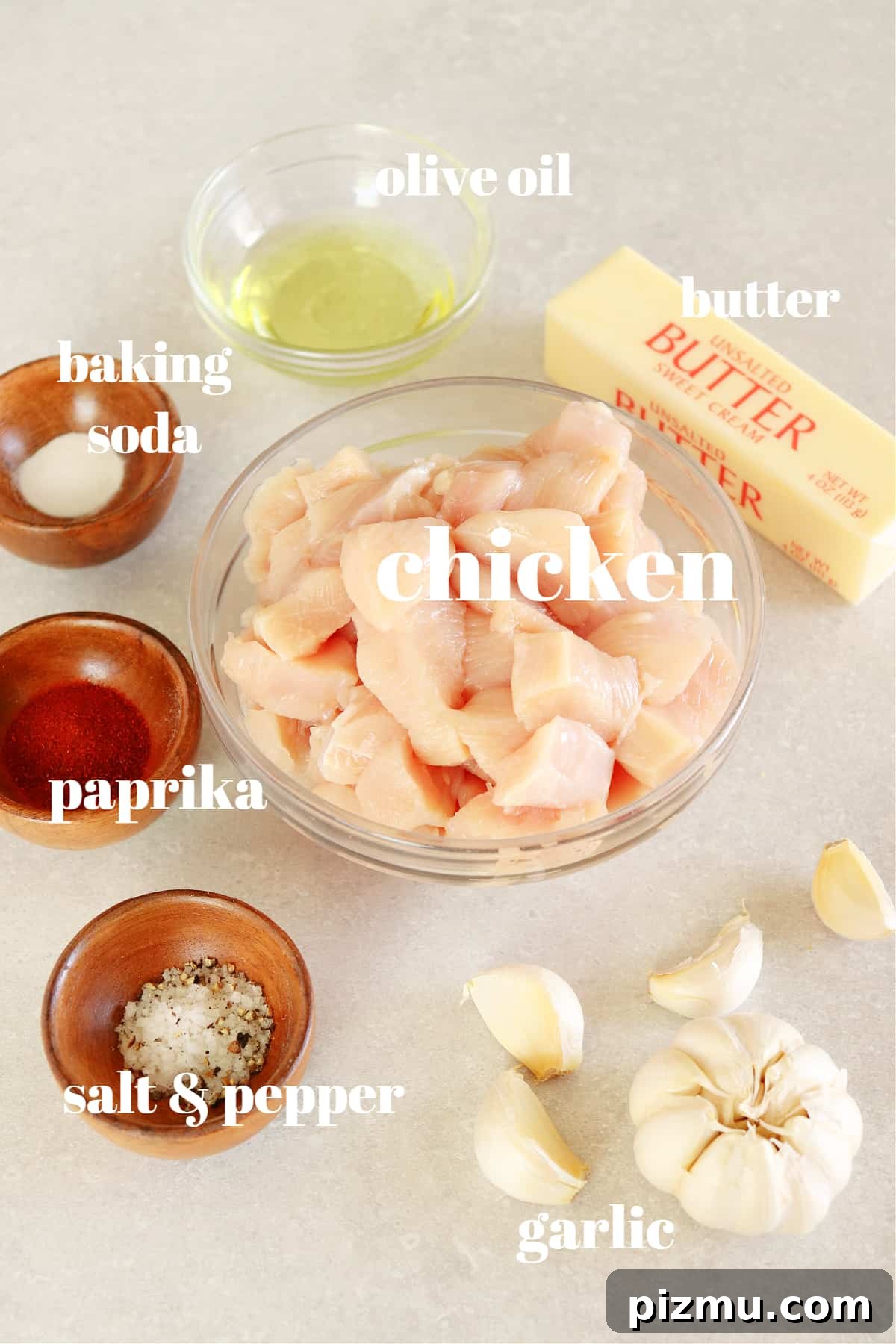 Garlic butter chicken ingredients. Ingredients for garlic butter chicken recipe on a gray board.