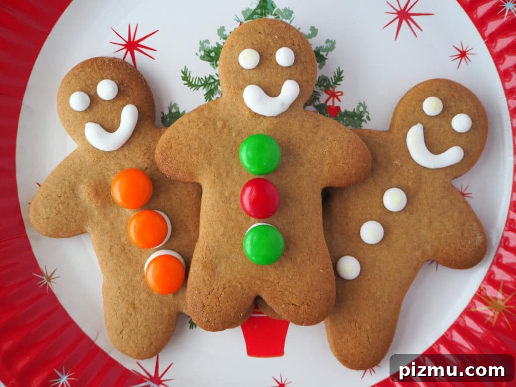 Trio of decorated gingerbread men on a Christmas plate