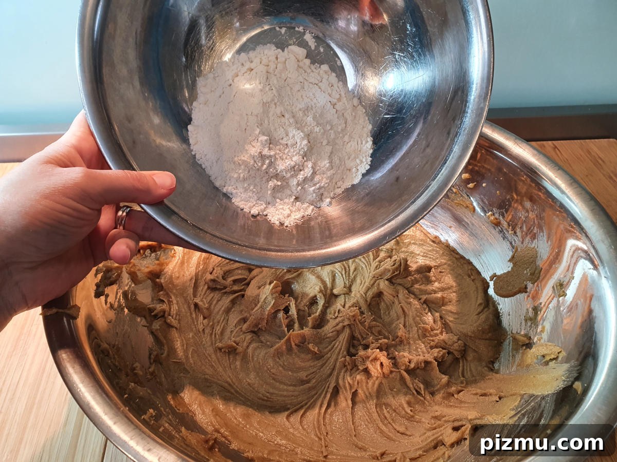 Adding flour one cup at a time