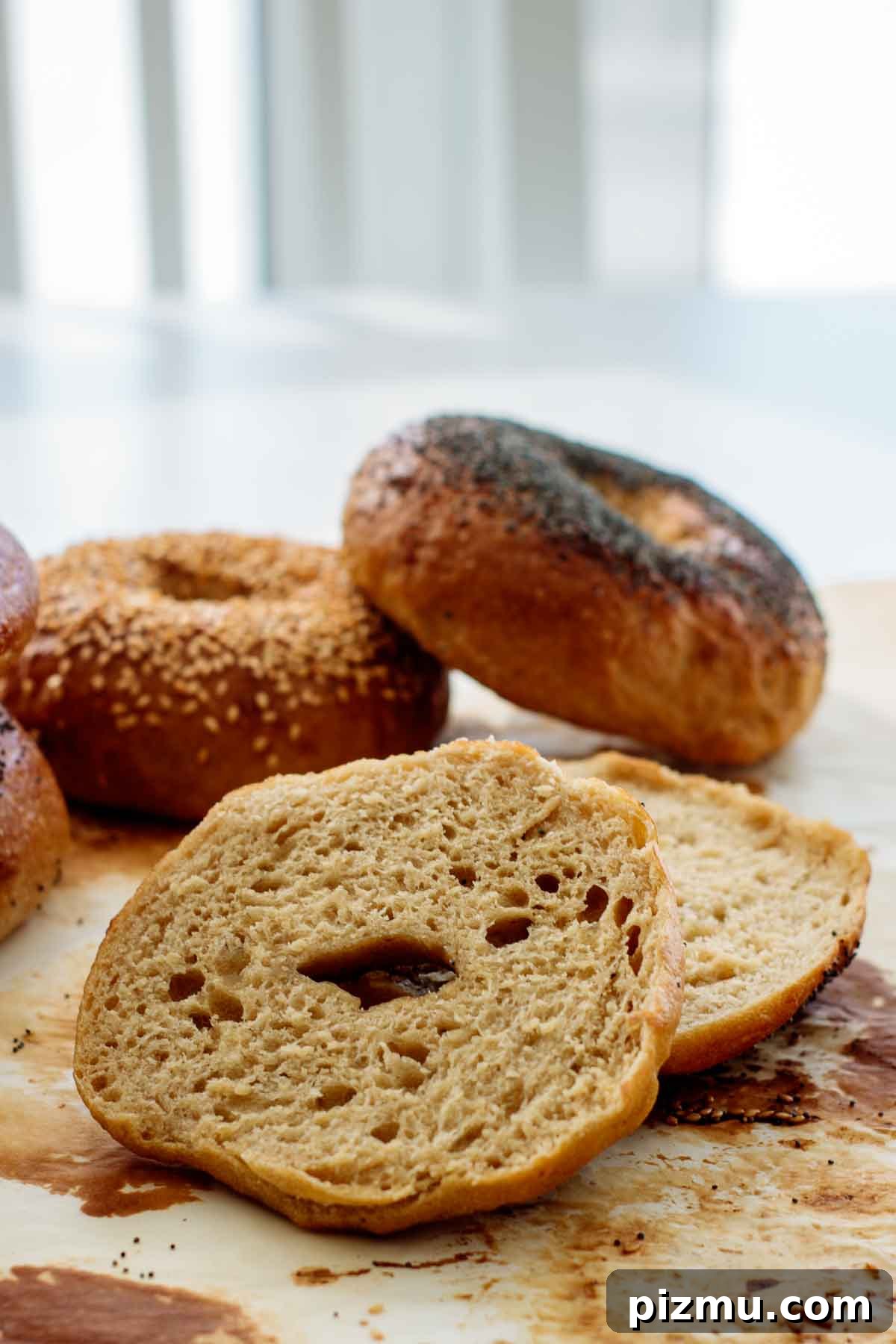 How to Make Sourdough Bagels at Home 8 sourdough bagel cut in half showing its crumb