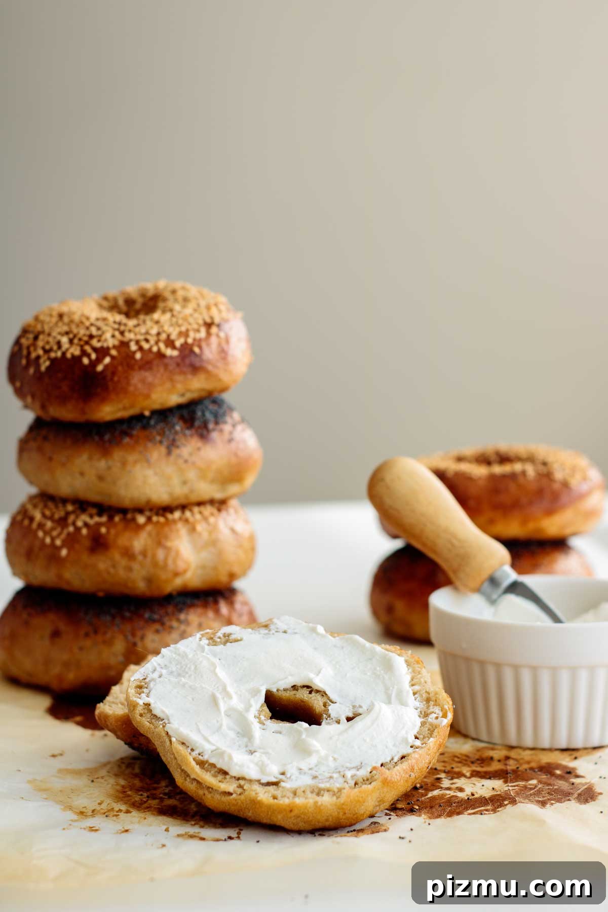 How to Make Sourdough Bagels at Home 9 bagel cut in half topped with cream cheese