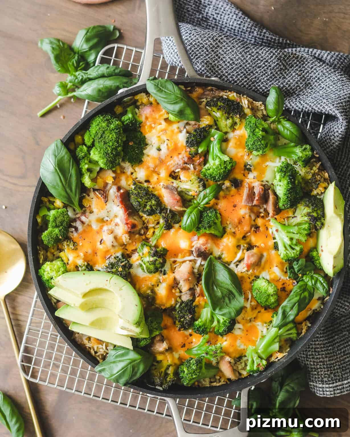 Cheesy Chicken, Broccoli and Rice Casserole 5 Easy Chicken Broccoli and Cheese Casserole on a cooling rack with a dish cloth