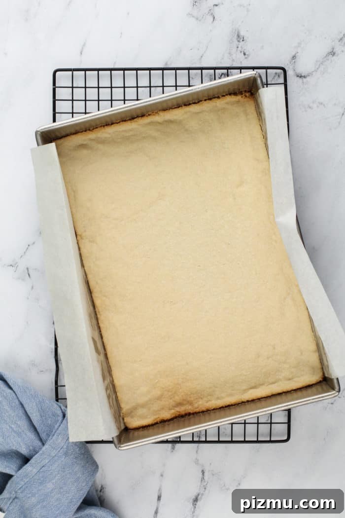 Creamy Layered Lemon Trifle Recipe 6 Baked crust for layered lemon dessert cooling on a wire rack.