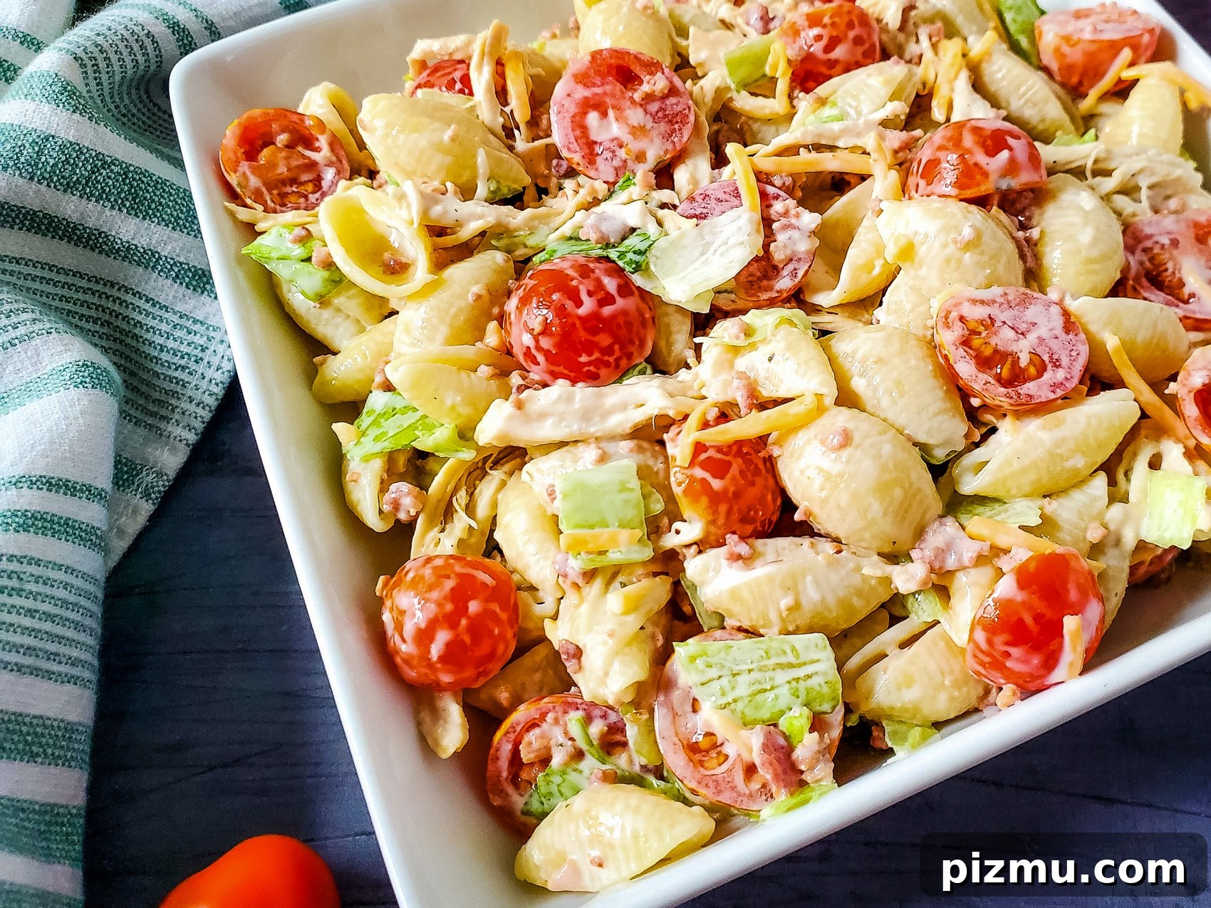 pasta salad with chicken, tomato, ranch, bacon and shredded cheese 