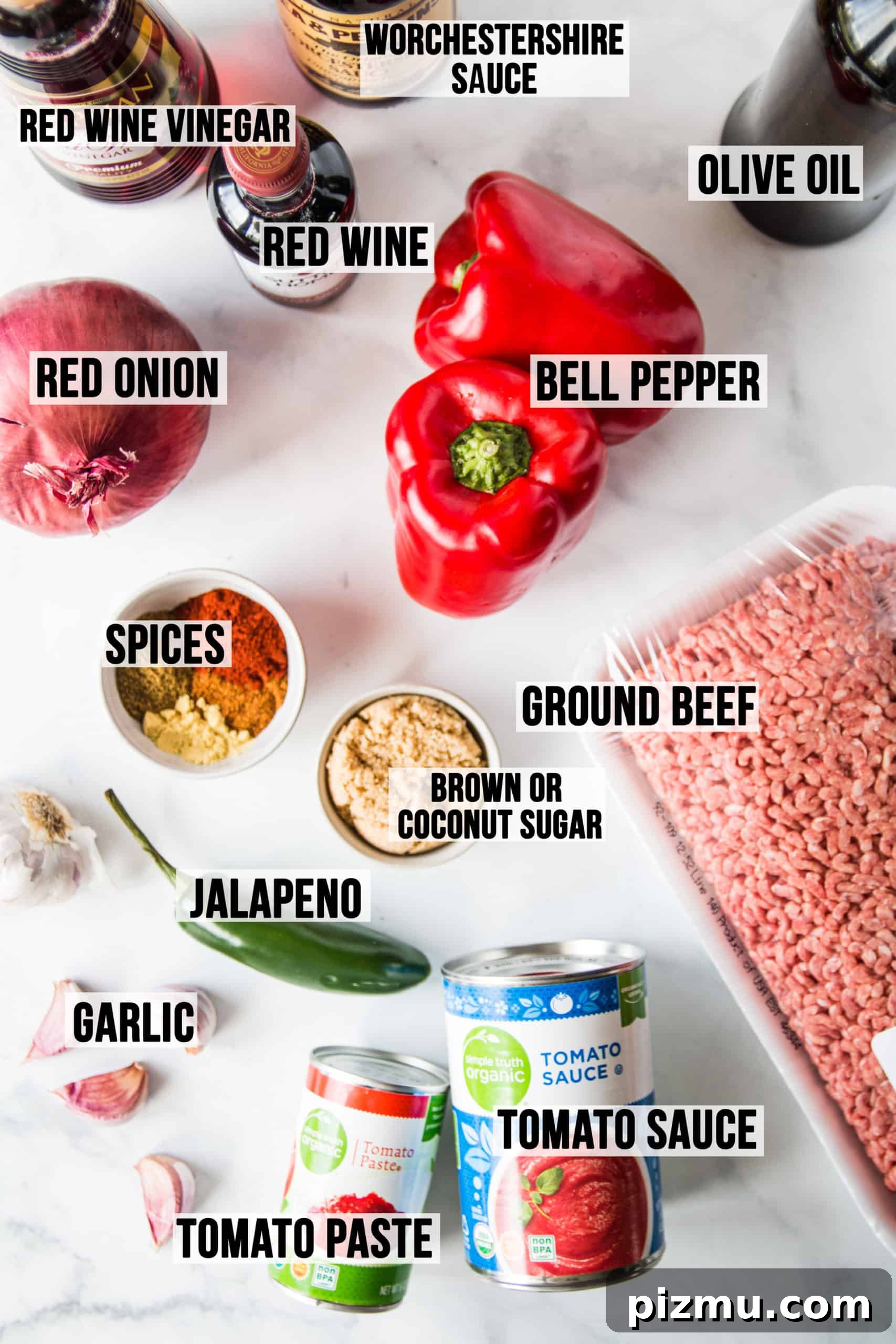 Homemade Gluten-Free Sloppy Joes 3 Ingredients in gluten free sloppy joes laid out on white surface.