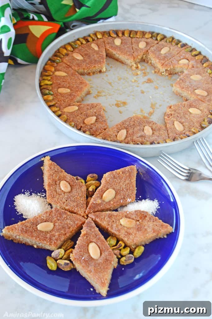 Basbousa: Classic Middle Eastern Semolina Cake with Syrup 8 pieces of semolina cake on a blue plate with the whole baking dish on the back