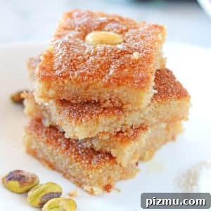 Basbousa: Classic Middle Eastern Semolina Cake with Syrup 9 A piece of Basbousa on a plate