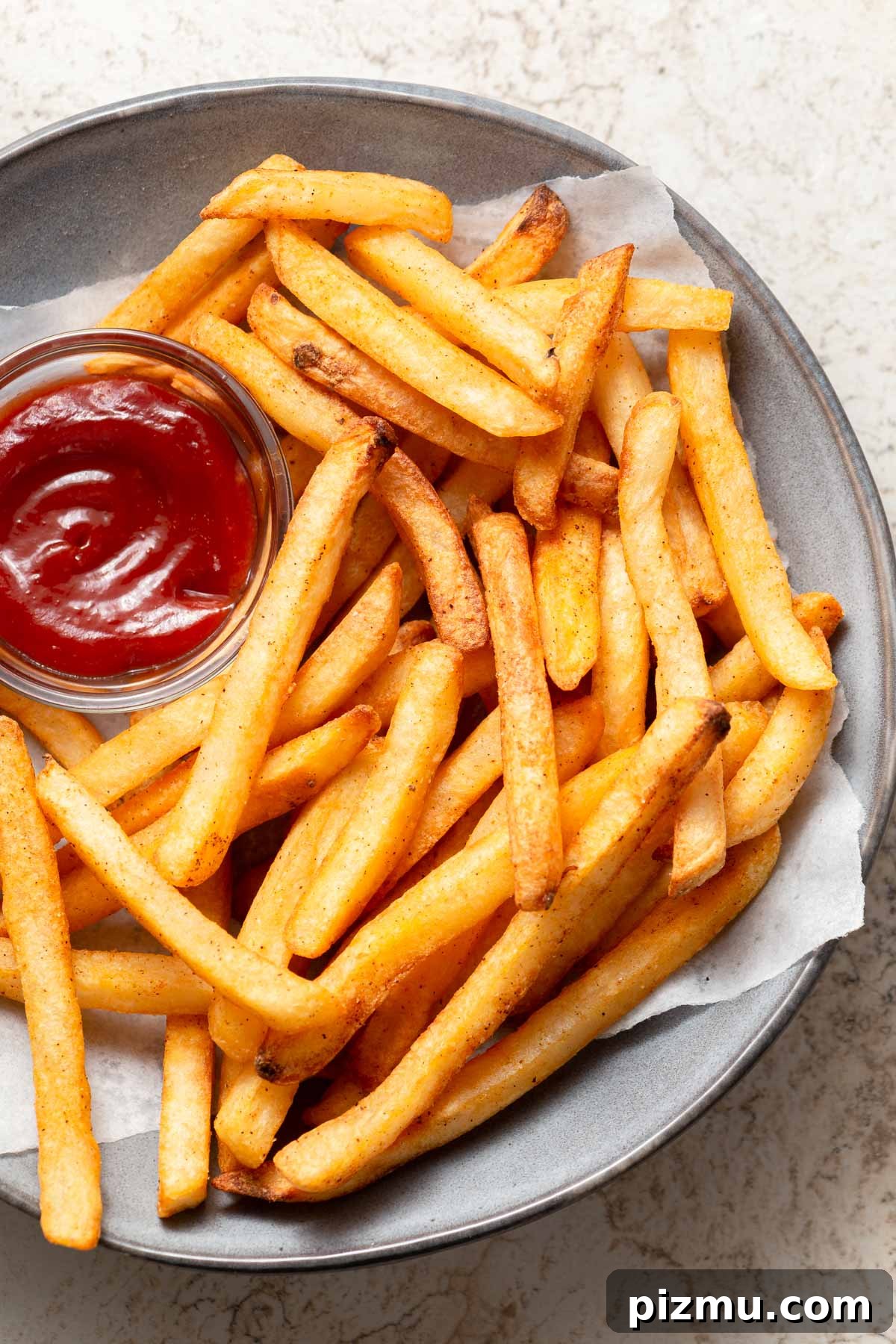 air fried frozen french fries on a plate with ketchup