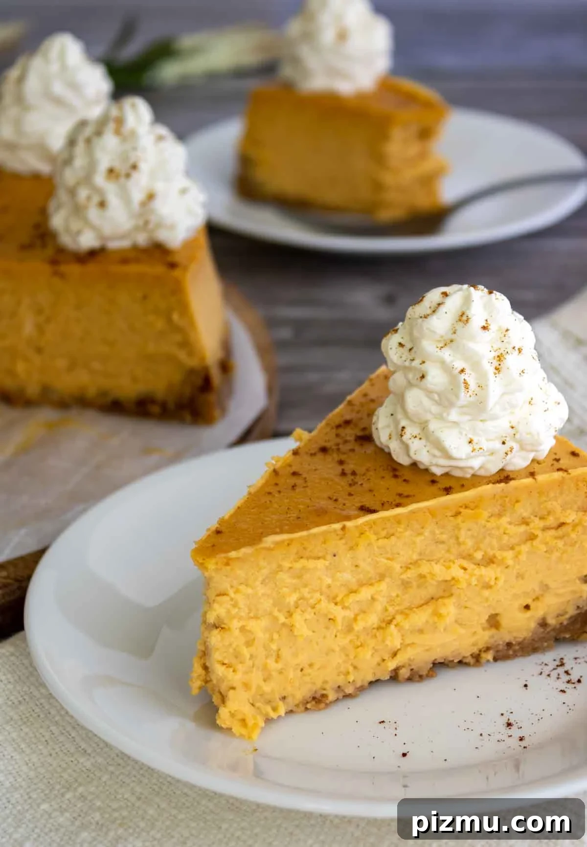 Paula Deen's Classic Pumpkin Cheesecake Recipe 2 a slice of pumpkin cheesecake on a plate.