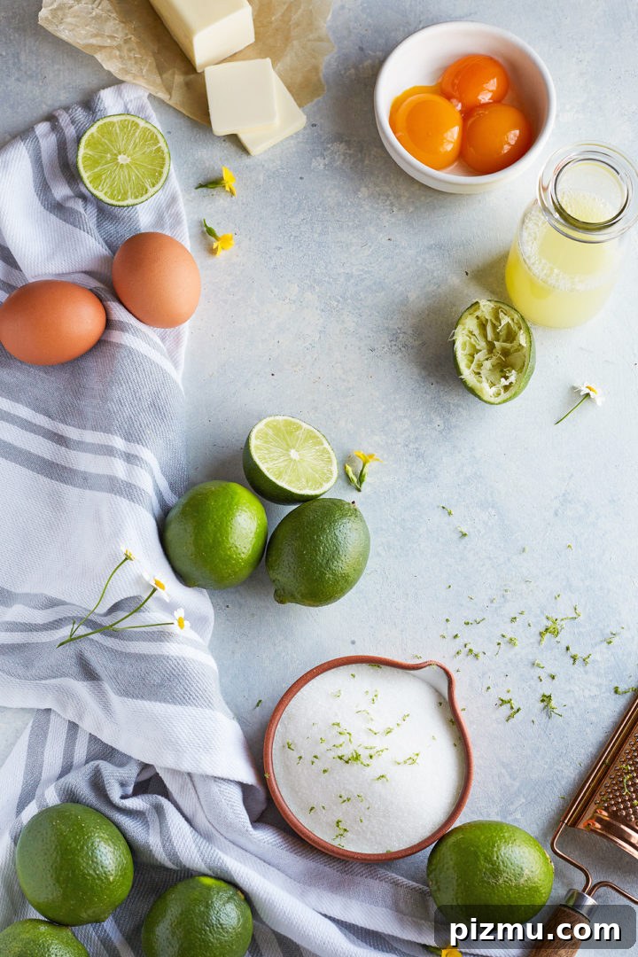How to Make Lime Curd: Zesty Homemade Recipe 4 ingredients needed to make lime curd on a light blue background with a striped kitchen towel