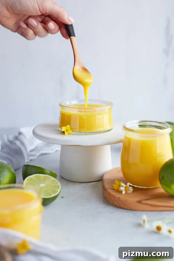 How to Make Lime Curd: Zesty Homemade Recipe 9 woman serving a spoonful of lime curd